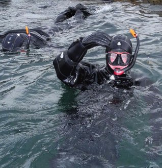 Snorkler giving an OK-signal during a guided snorkling trip in Saltstraumen